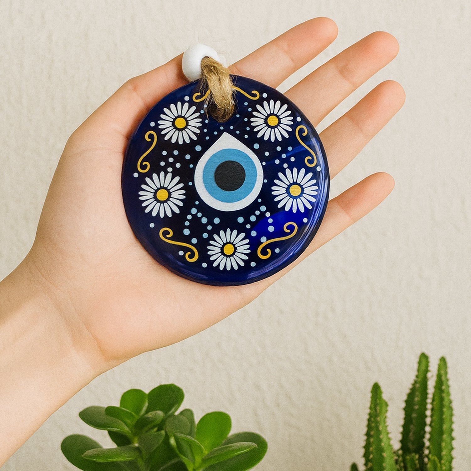 Evil Eye Wall Hanging charm hanging inside a car symbolizing protection for driver
