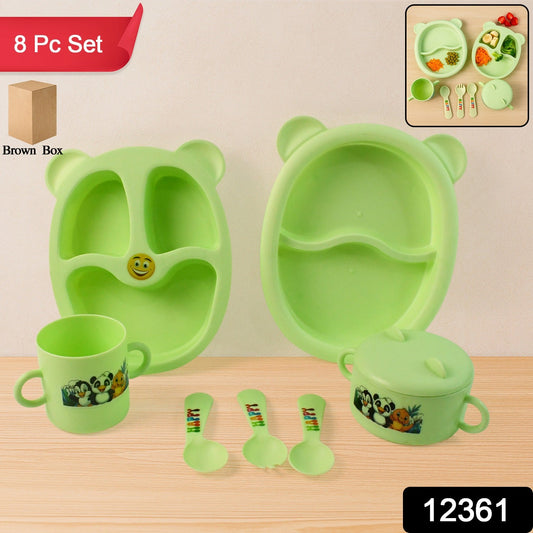 Colorful children's mealtime feeding set with bowl, mug, spoons, and sectioned plates